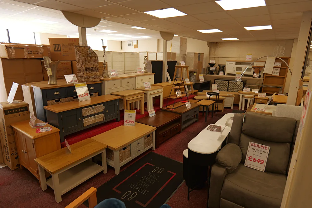 TV units, cabinets, occasional tables and an armchair inside the Armagh showroom